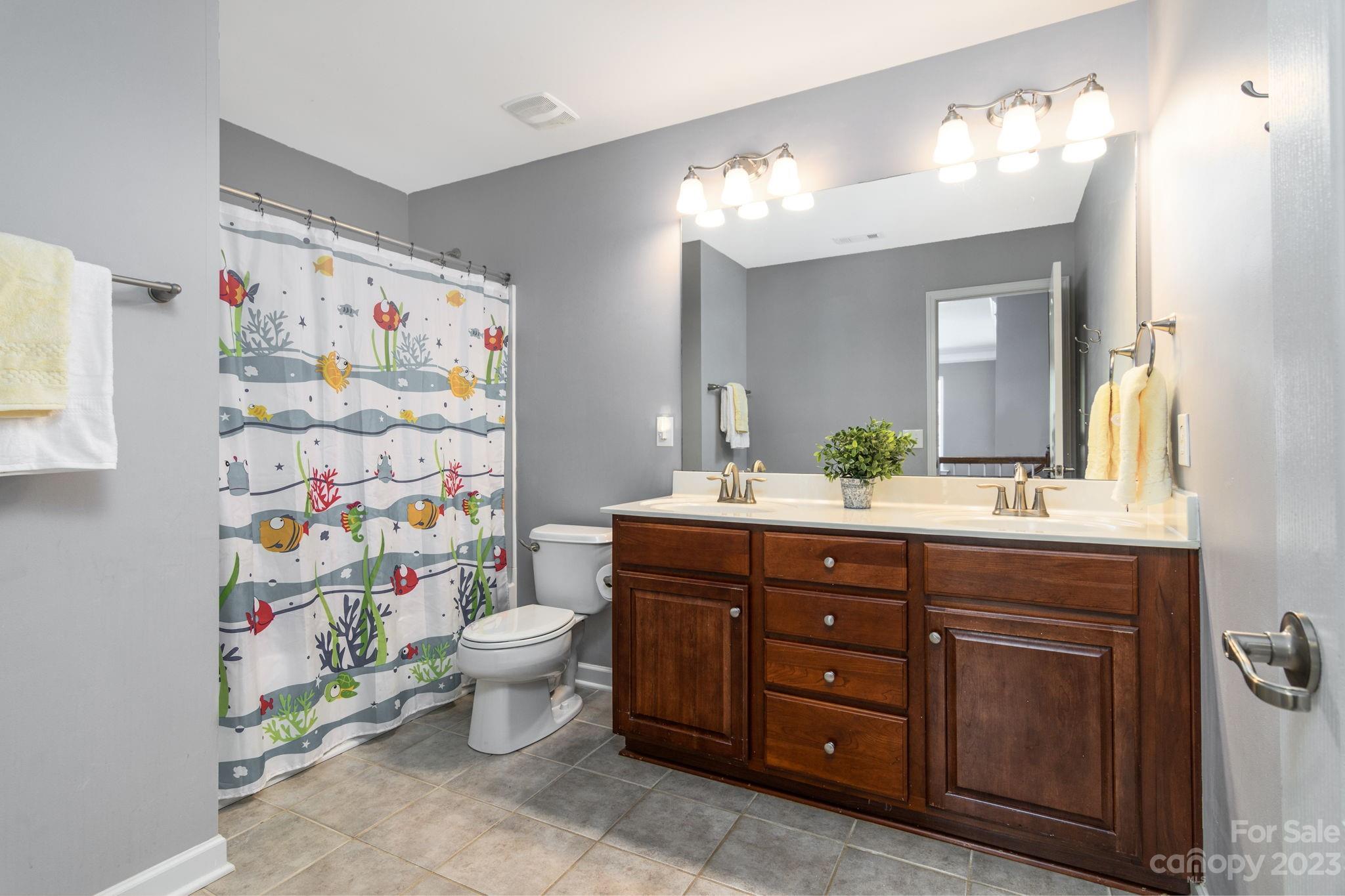 582 Evening Mist Drive Fort Mill, SC 29708 - Photo 22 of 31 a bathroom with a sink vanity and a toilet