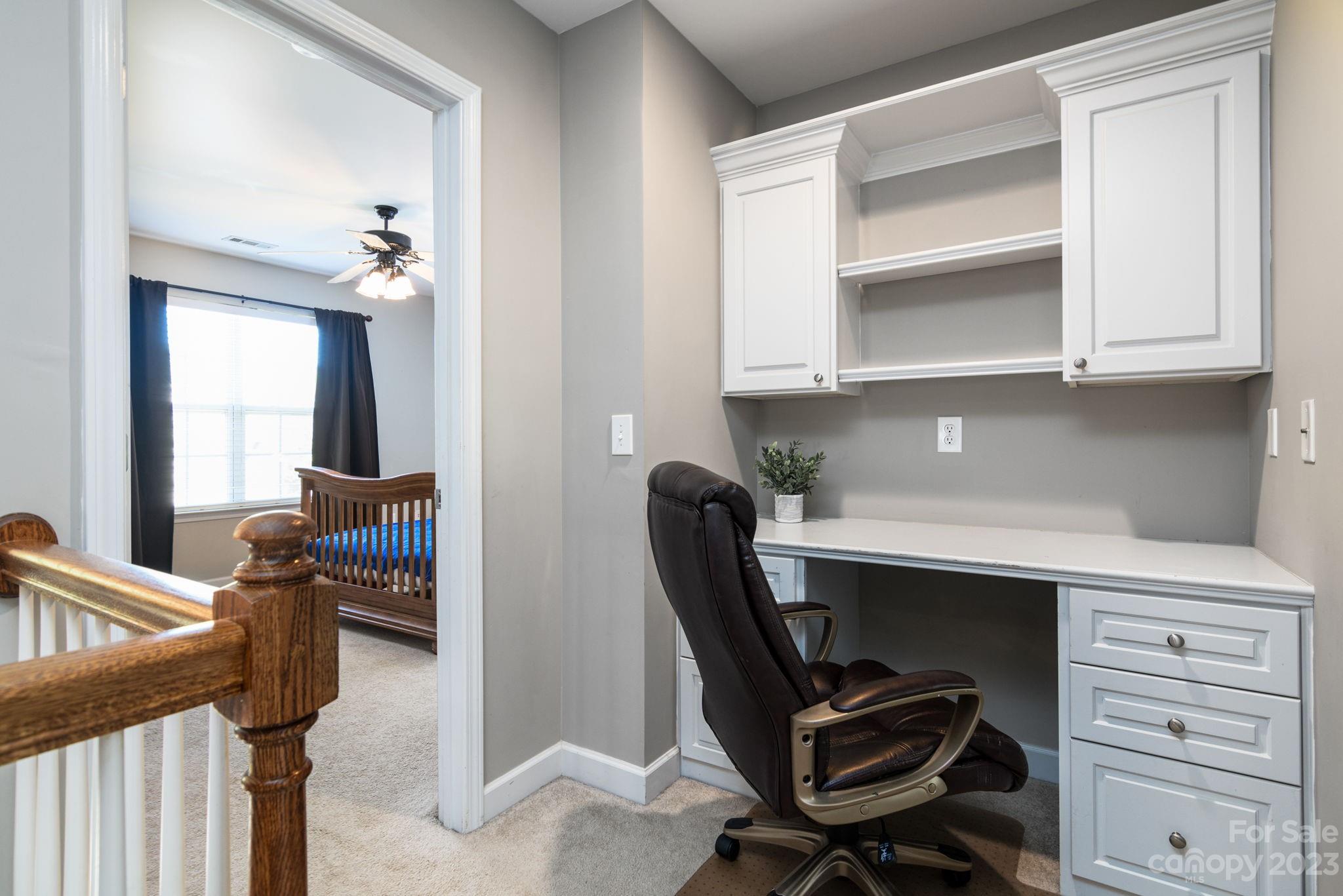 582 Evening Mist Drive Fort Mill, SC 29708 - Photo 23 of 31 a view of a workspace with furniture and a window