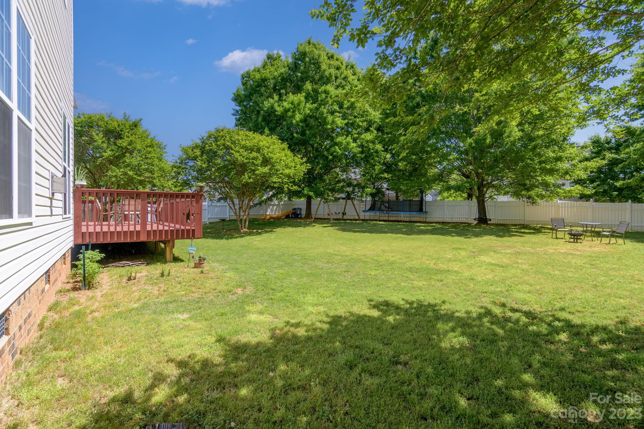 582 Evening Mist Drive Fort Mill, SC 29708 - Photo 30 of 31 a view of yard with swimming pool and trees