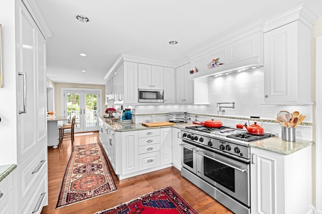 73 Pond Street Cohasset, MA 02025 - Photo 13 of 42 a kitchen with stove and cabinets
