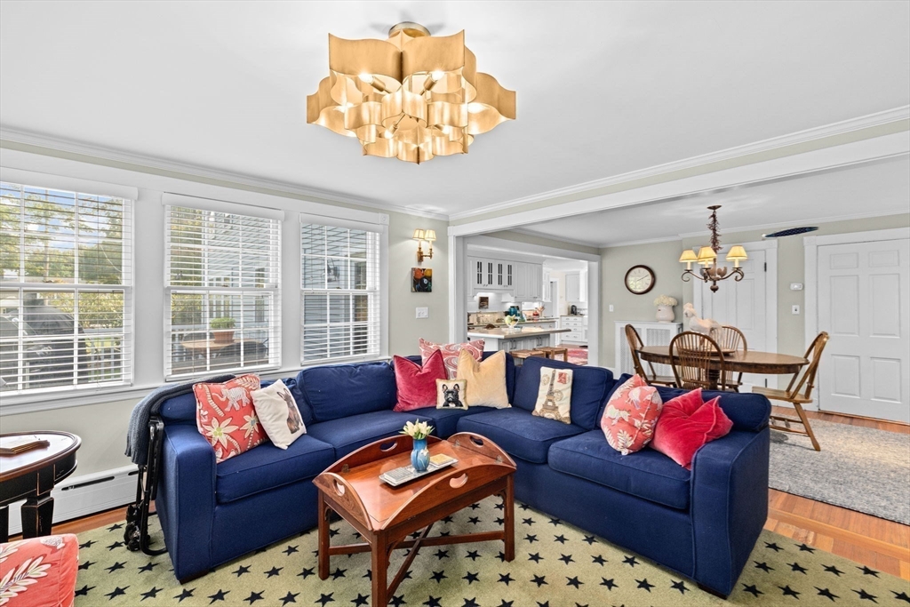 73 Pond Street Cohasset, MA 02025 - Photo 16 of 42 a living room with furniture a chandelier and a dining table