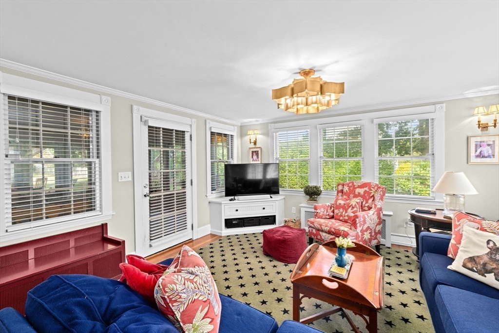 73 Pond Street Cohasset, MA 02025 - Photo 17 of 42 a bedroom with furniture and a flat screen tv
