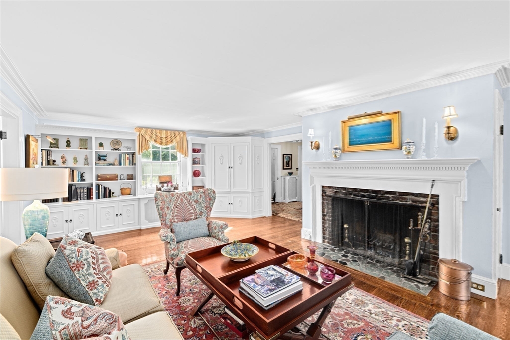 73 Pond Street Cohasset, MA 02025 - Photo 22 of 42 a living room with furniture and a fireplace