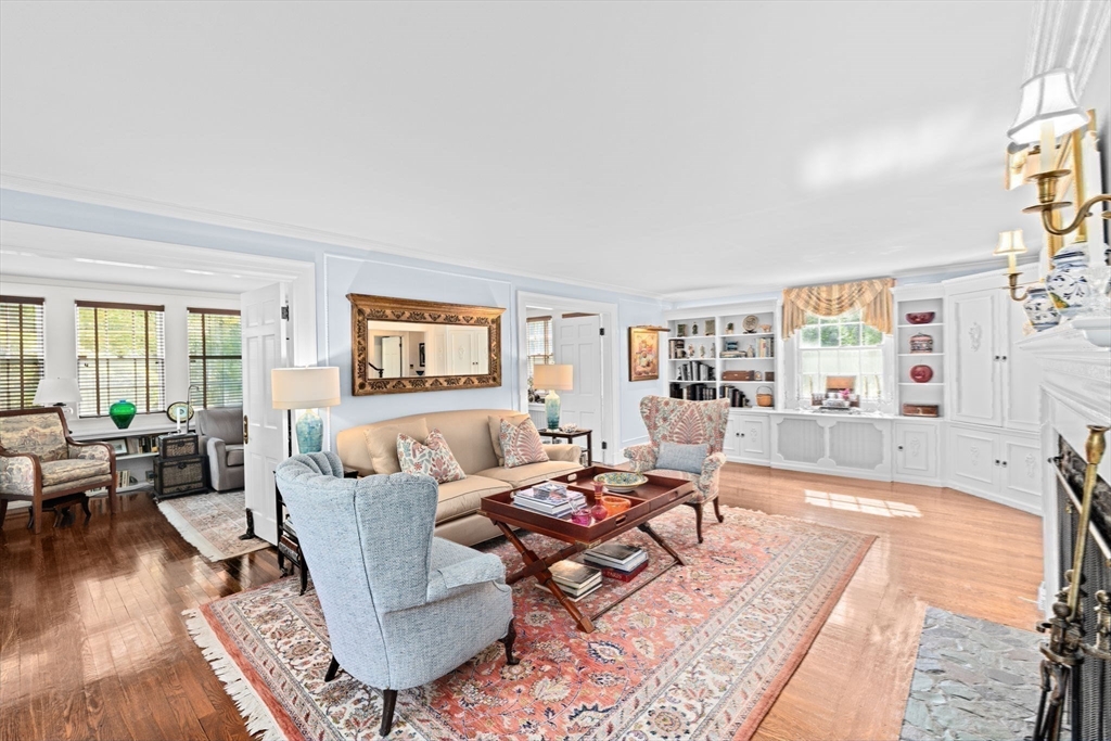 73 Pond Street Cohasset, MA 02025 - Photo 24 of 42 a living room with furniture and a table