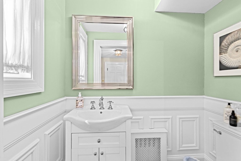 73 Pond Street Cohasset, MA 02025 - Photo 27 of 42 a bathroom with a sink and a mirror