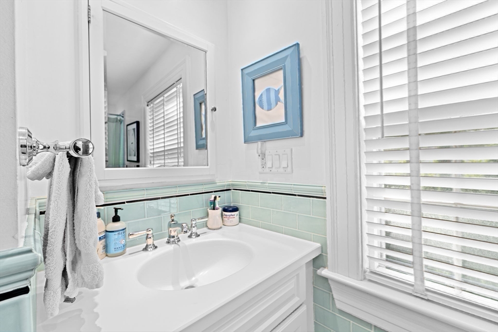 73 Pond Street Cohasset, MA 02025 - Photo 31 of 42 a bathroom with a sink and a mirror