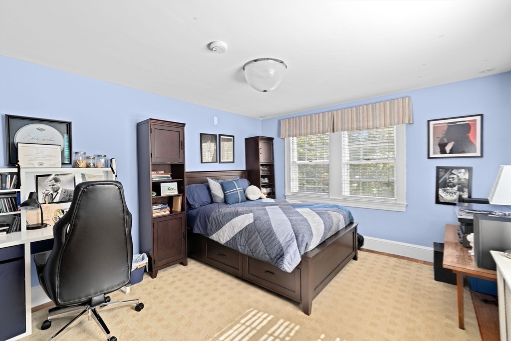 73 Pond Street Cohasset, MA 02025 - Photo 32 of 42 a bed room with a bed and a desk