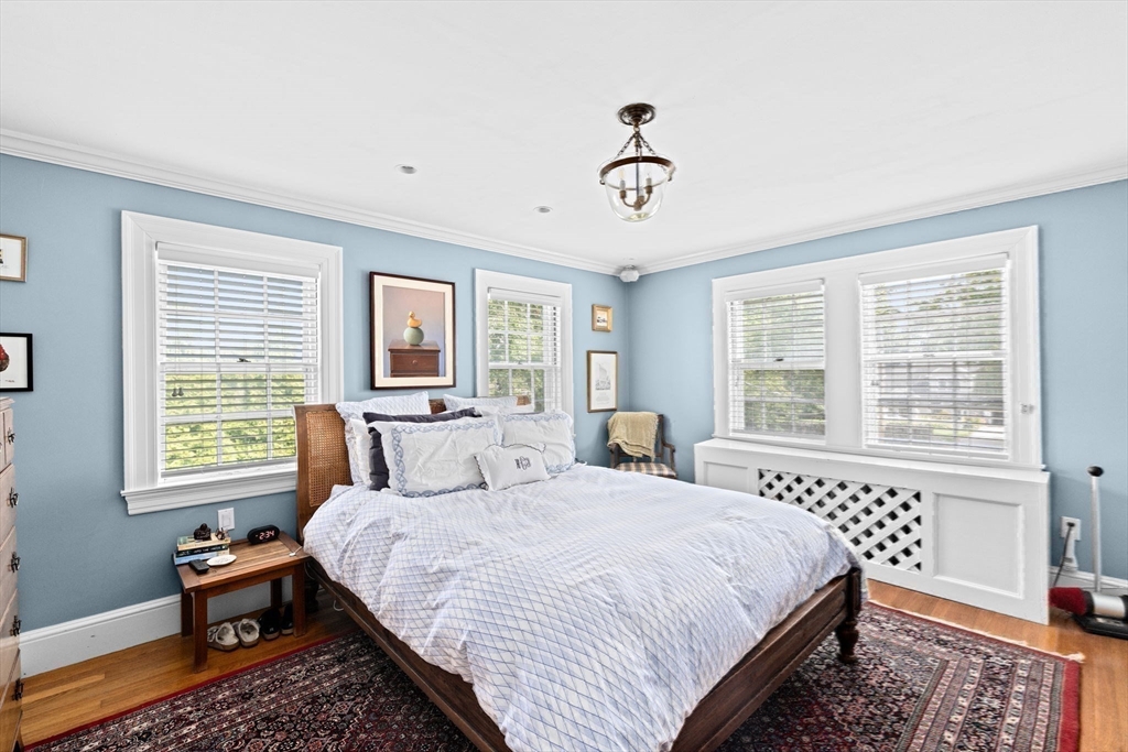 73 Pond Street Cohasset, MA 02025 - Photo 33 of 42 a bedroom with a large bed and a window