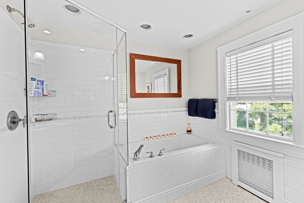 73 Pond Street Cohasset, MA 02025 - Photo 35 of 42 a bathroom with a bathtub a window and a shower