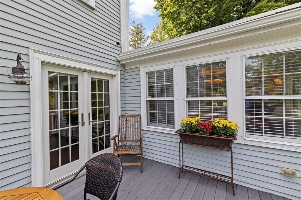73 Pond Street Cohasset, MA 02025 - Photo 8 of 42 a view of a porch with chairs