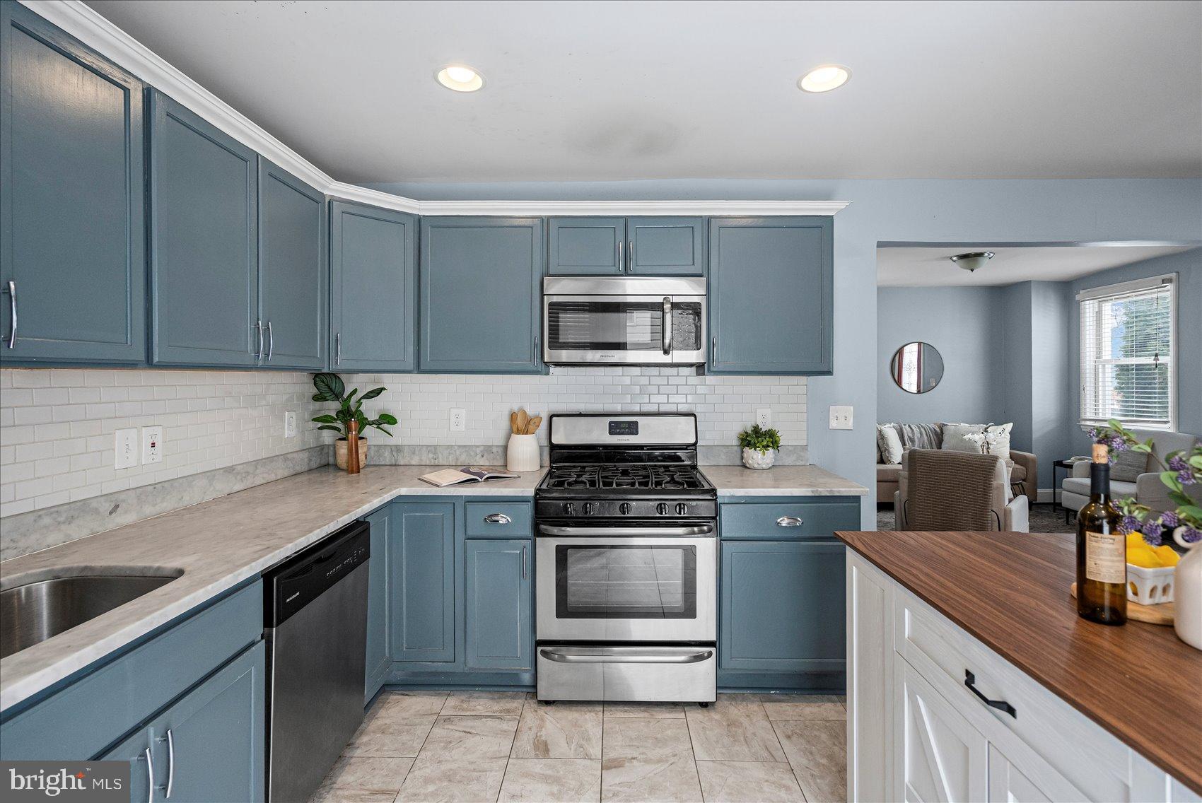 7708 Middlesex Place Parkville, MD 21234 - Photo 11 of 37 Charming kitchen with modern finishes.