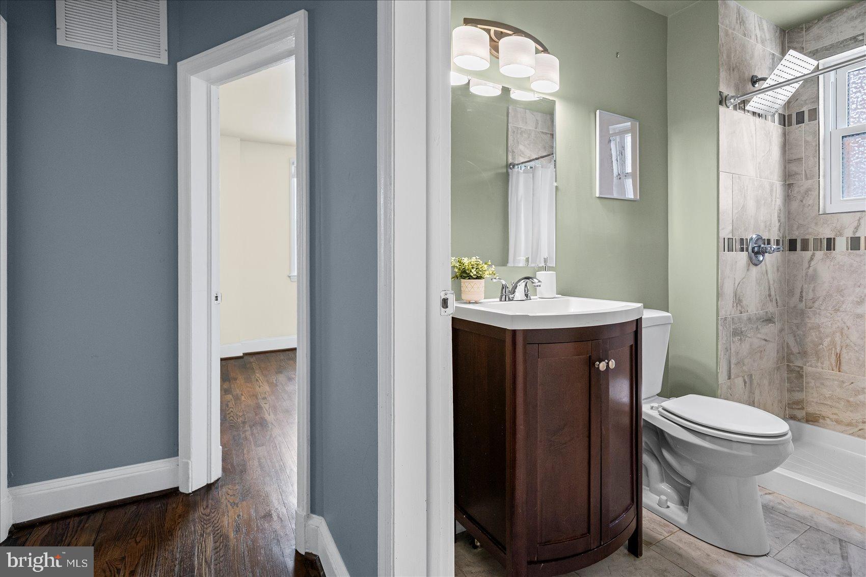 7708 Middlesex Place Parkville, MD 21234 - Photo 18 of 37 Charming bathroom with modern finishes.