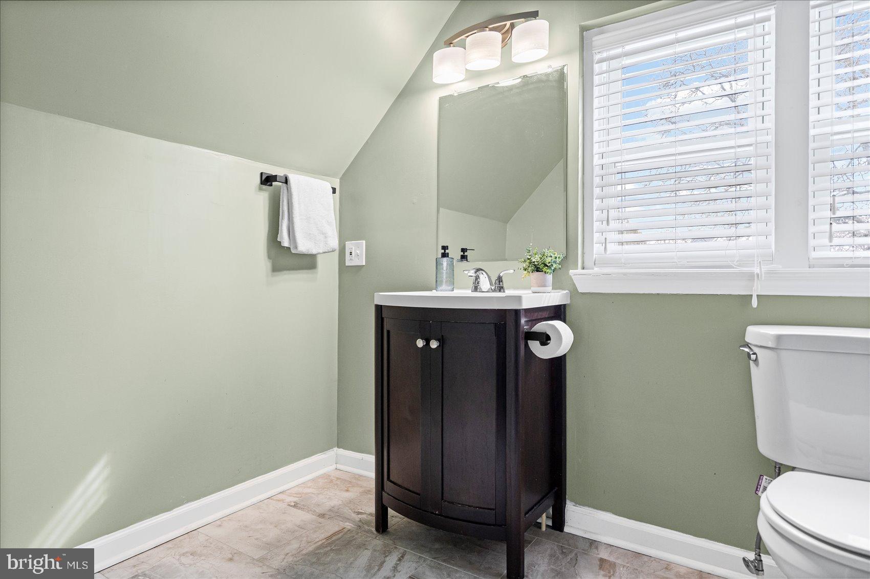 7708 Middlesex Place Parkville, MD 21234 - Photo 19 of 37 Charming bathroom with soothing green hues.