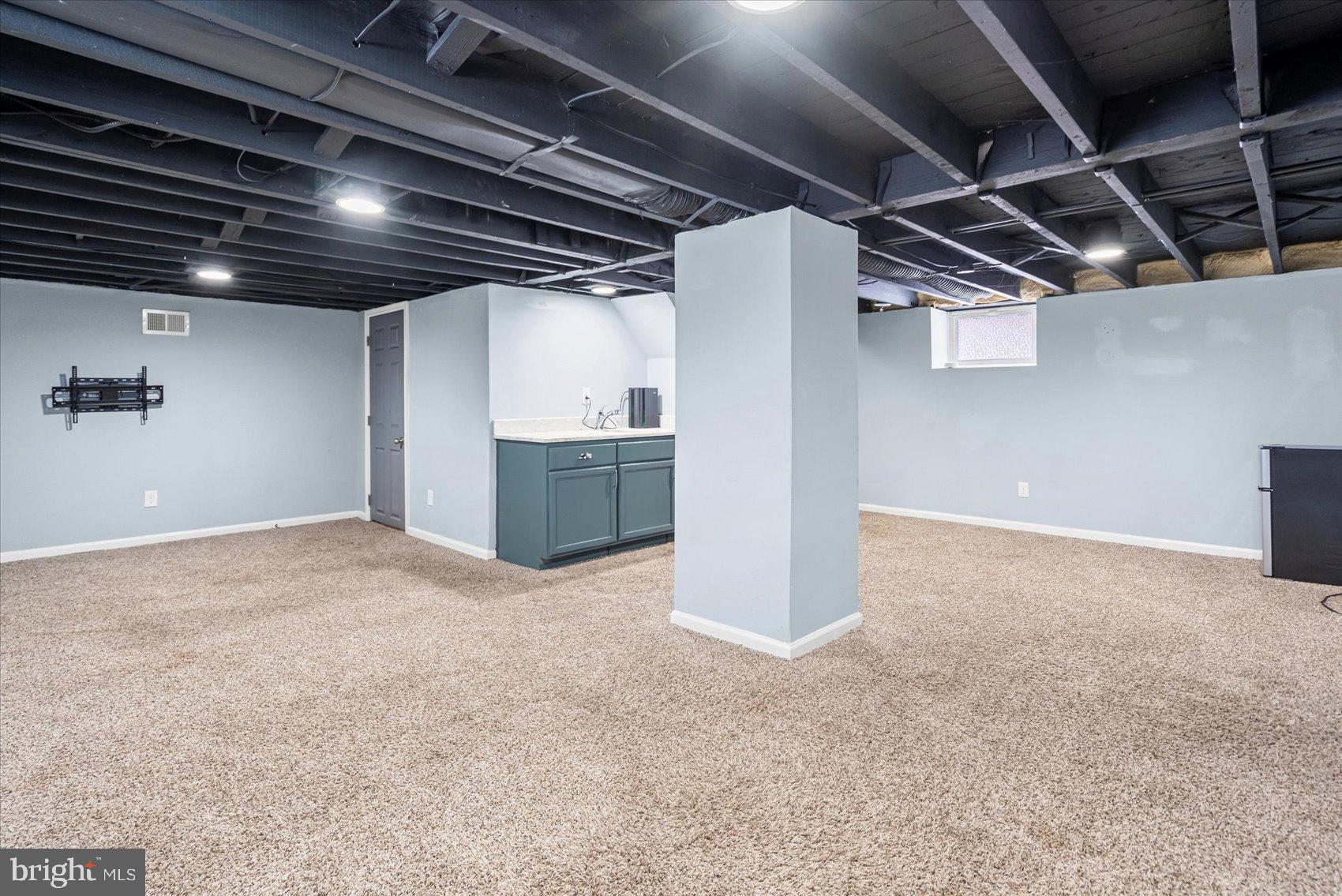 7708 Middlesex Place Parkville, MD 21234 - Photo 25 of 37 Spacious, versatile basement with modern finishes.