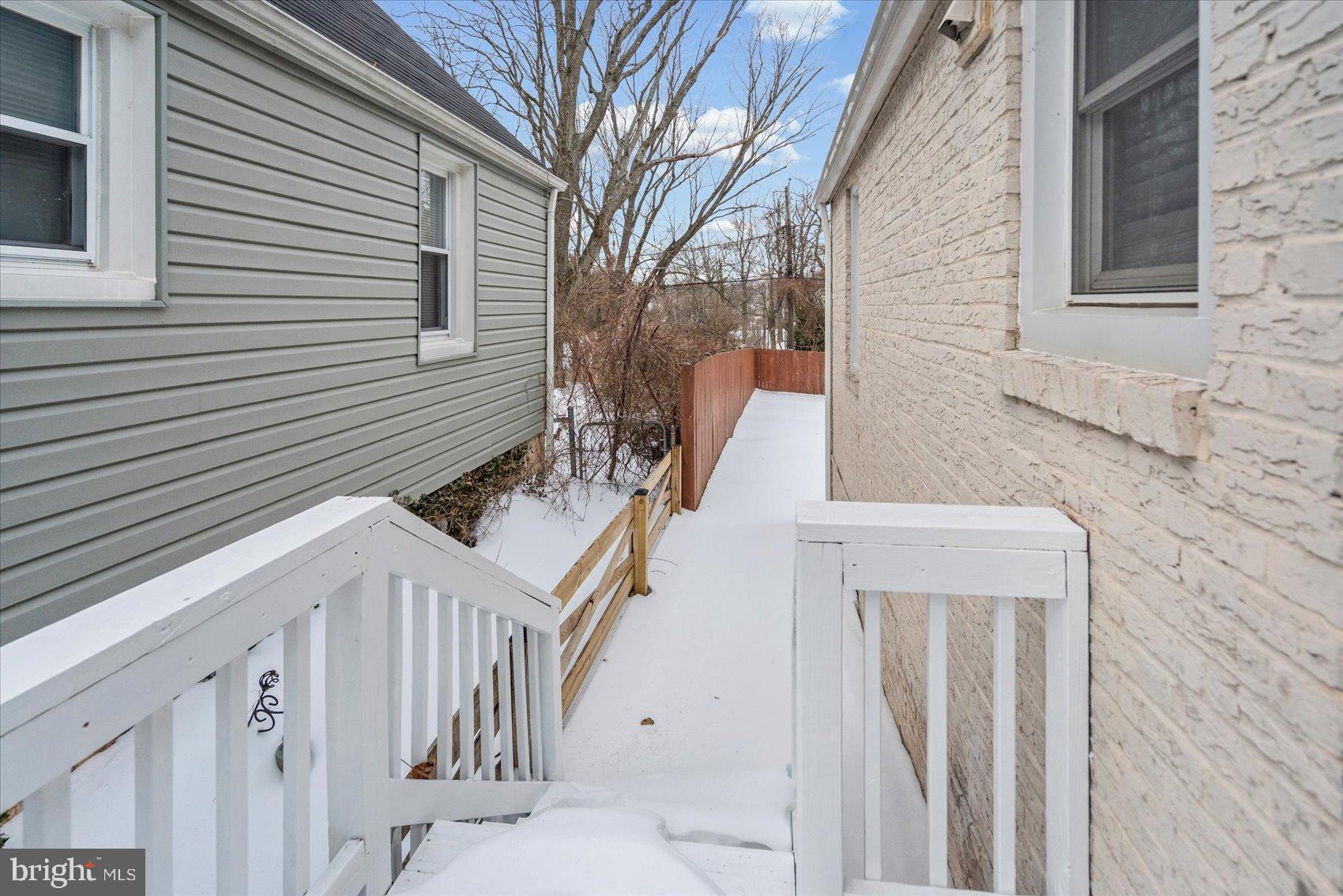 7708 Middlesex Place Parkville, MD 21234 - Photo 30 of 37 Charming winter pathway to serene backyard.
