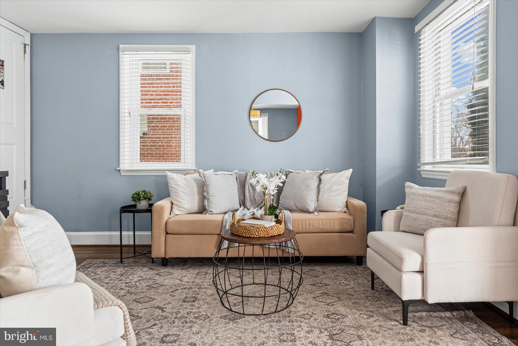 7708 Middlesex Place Parkville, MD 21234 - Photo 3 of 37 Charming living space with soft blue hues.