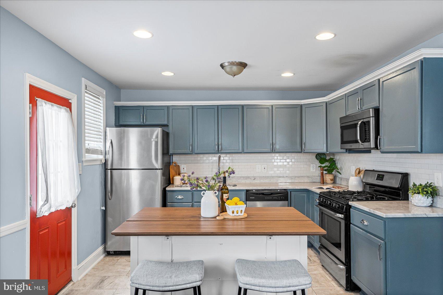 7708 Middlesex Place Parkville, MD 21234 - Photo 8 of 37 Charming kitchen with vibrant accents.