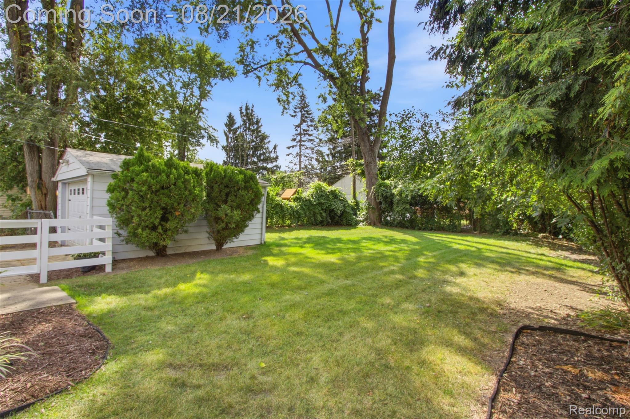 1383 Princeton Road Berkley, MI 48072 - Photo 22 of 28 Expansive grassy yard with mature trees and a detached structure
