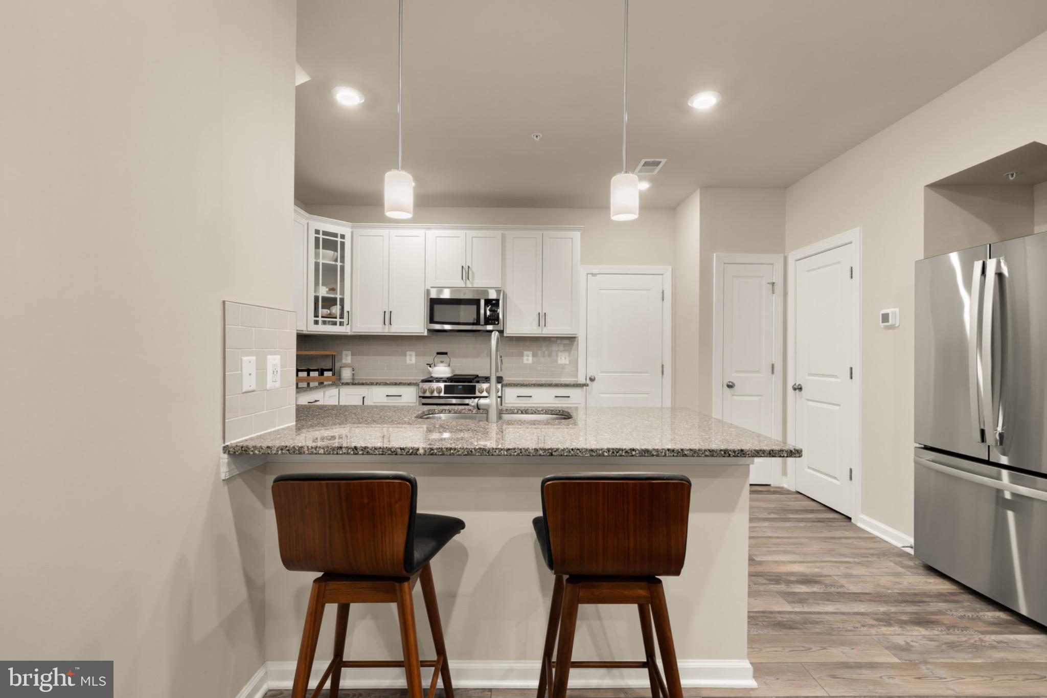 14967 River Walk Way Woodbridge, VA 22191 - Photo 17 of 38 Enjoy a morning cup of coffee at the breakfast bar