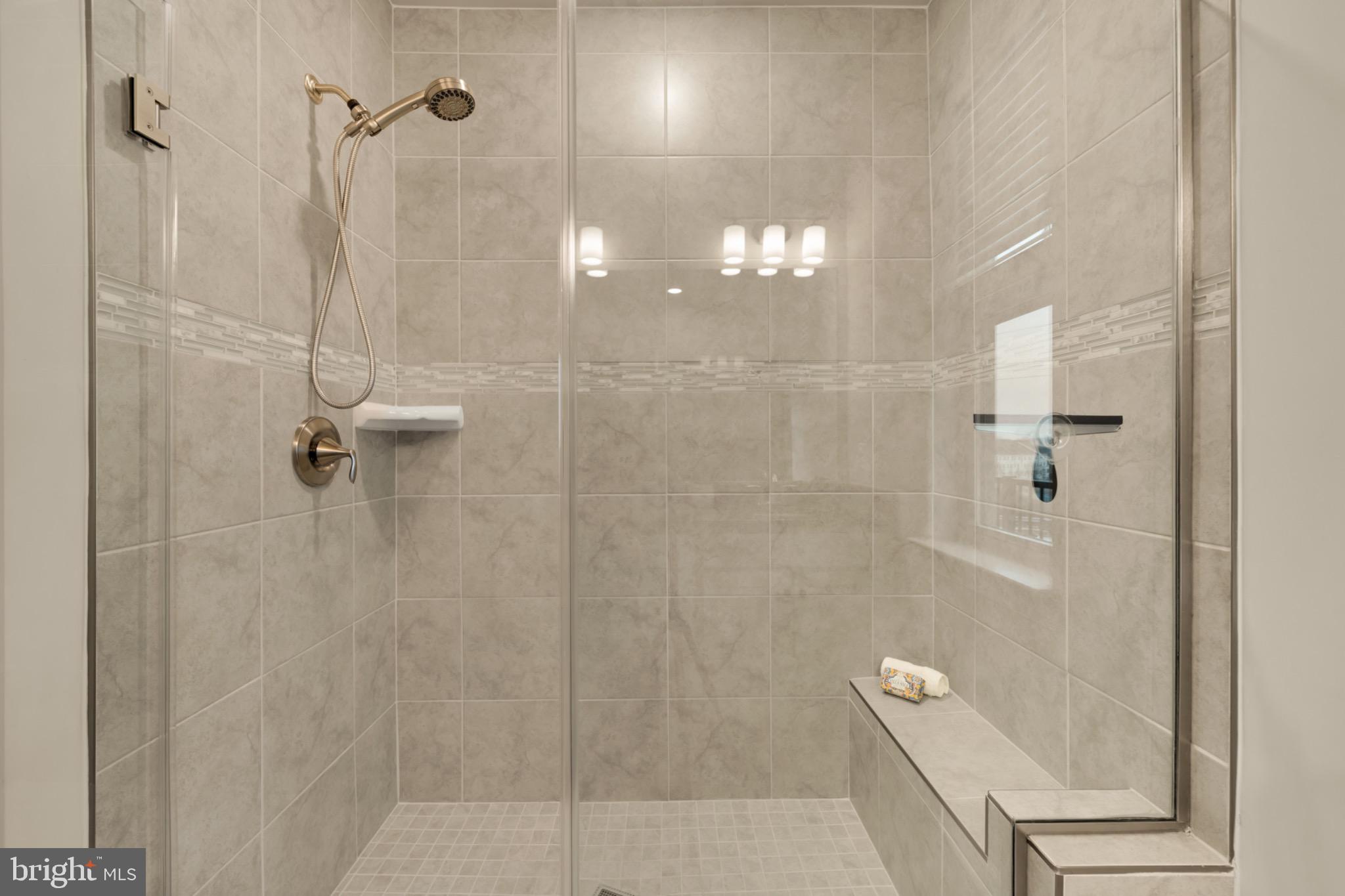14967 River Walk Way Woodbridge, VA 22191 - Photo 24 of 38 Sleek modern shower with elegant tile design.