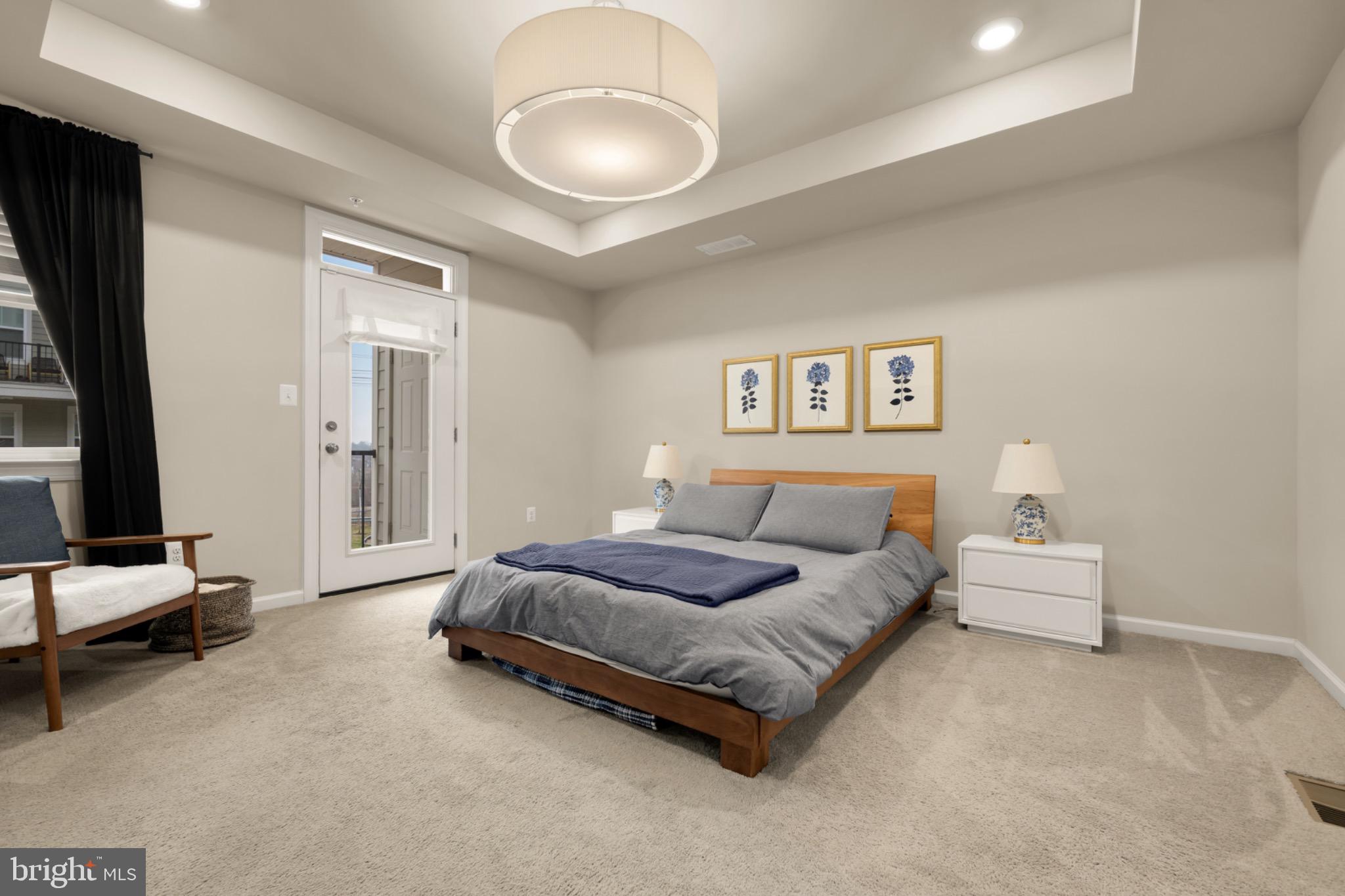 14967 River Walk Way Woodbridge, VA 22191 - Photo 4 of 38 Spacious primary bedroom opens to covered balcony