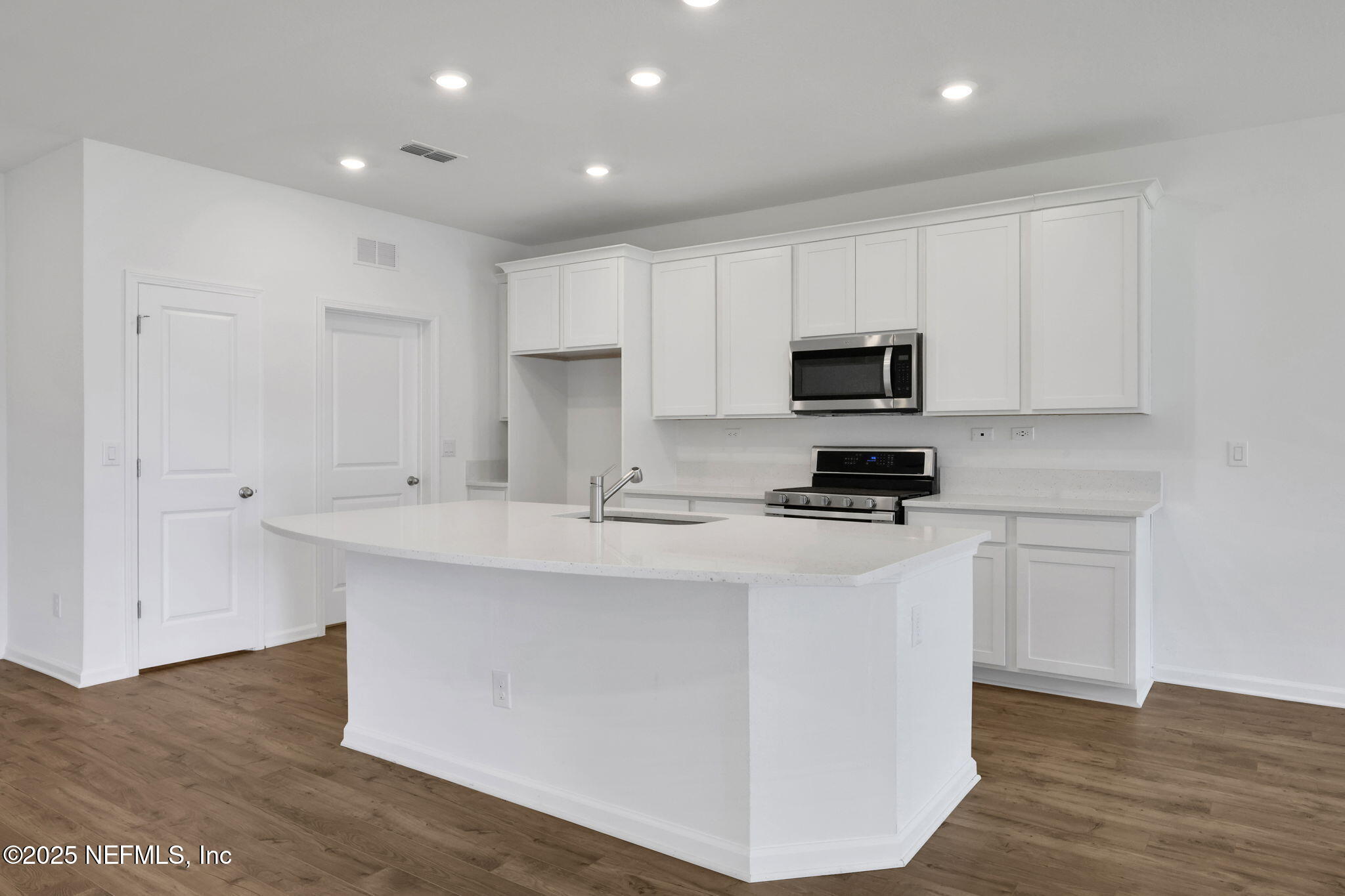 44 Martos Court St. Augustine, FL 32095 - Photo 16 of 40 a kitchen with stainless steel appliances granite countertop a stove a sink and a microwave