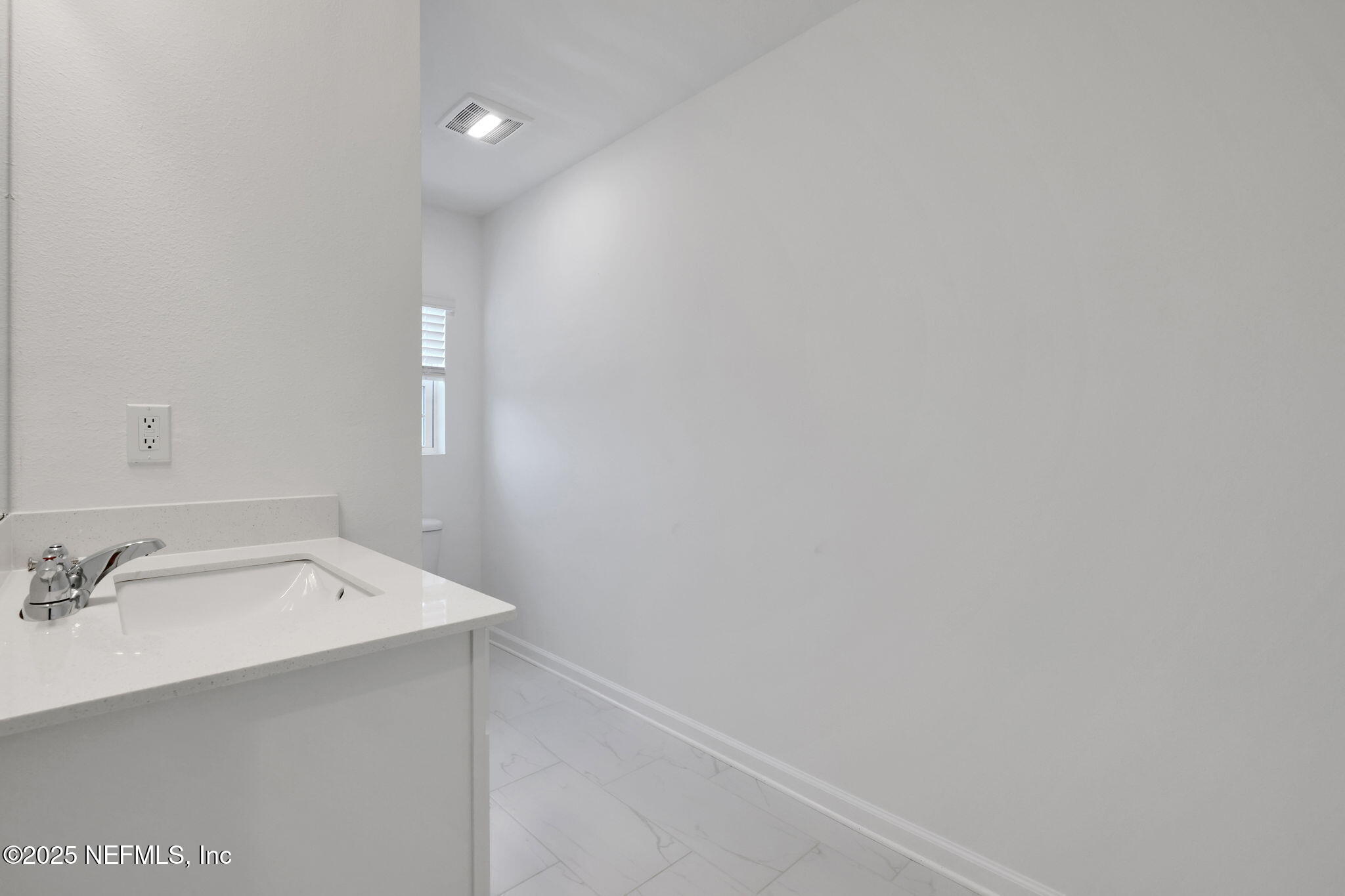 44 Martos Court St. Augustine, FL 32095 - Photo 26 of 40 a bathroom with a sink and a mirror