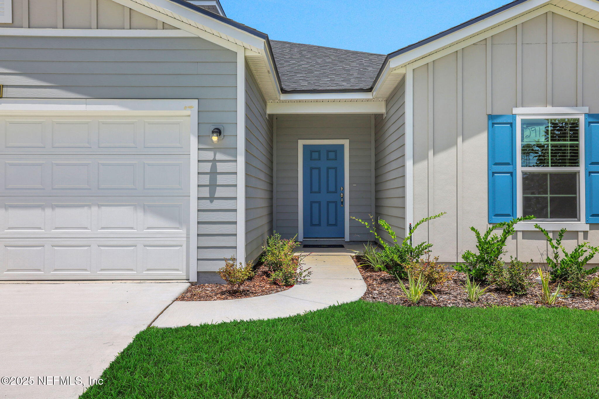 44 Martos Court St. Augustine, FL 32095 - Photo 3 of 40 a front view of a house with a garden and plants