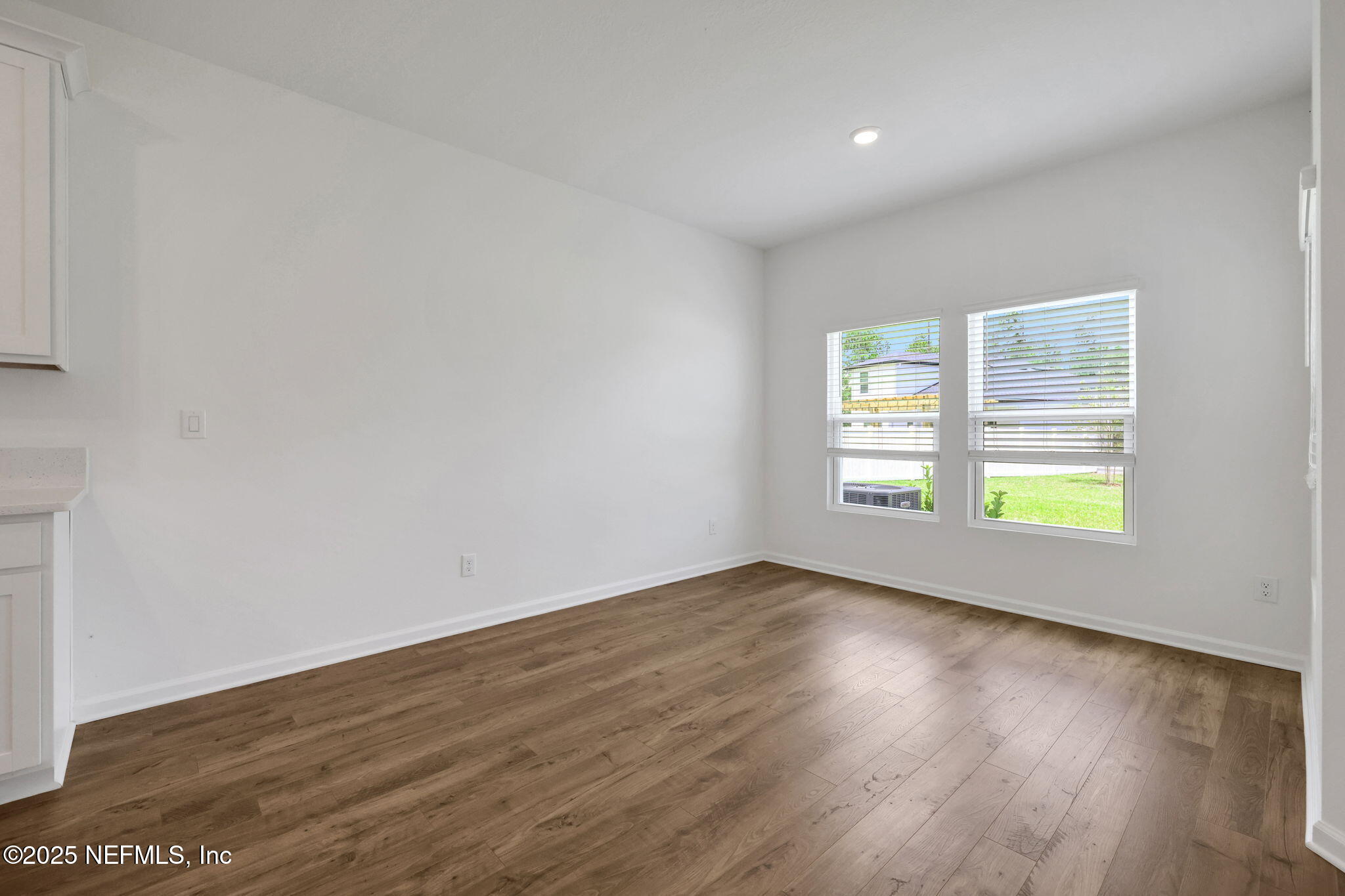 44 Martos Court St. Augustine, FL 32095 - Photo 33 of 40 an empty room with wooden floor and windows