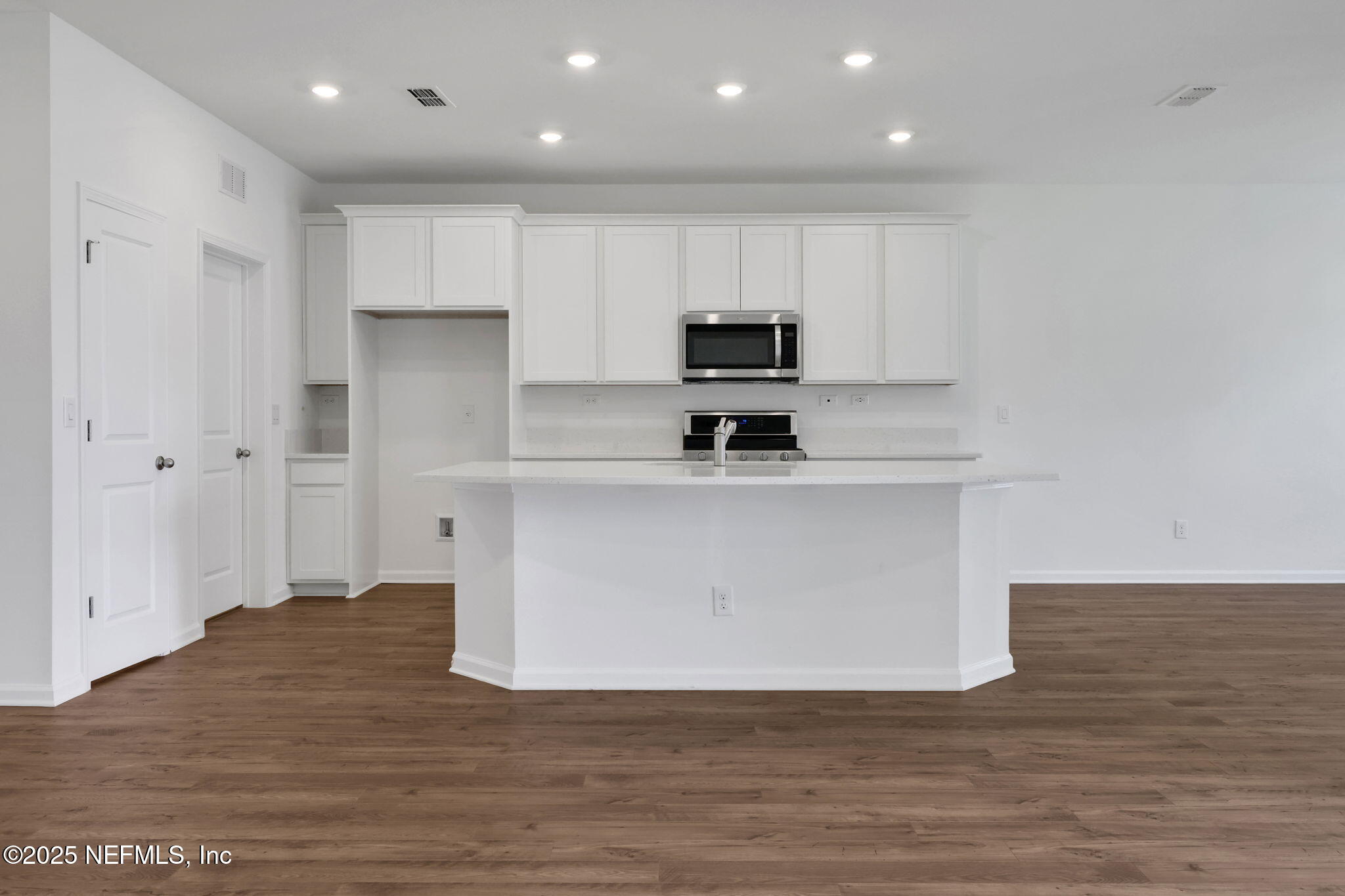 44 Martos Court St. Augustine, FL 32095 - Photo 9 of 40 a kitchen with stainless steel appliances a refrigerator sink and white cabinets