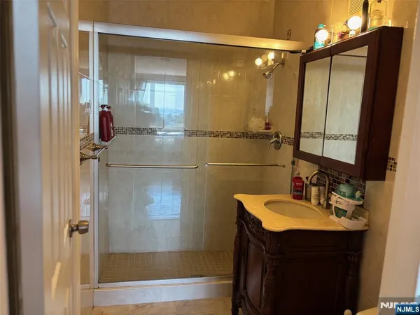 a bathroom with a sink and mirror