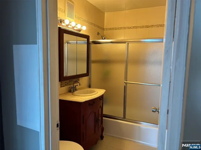 a bathroom with a sink and mirror