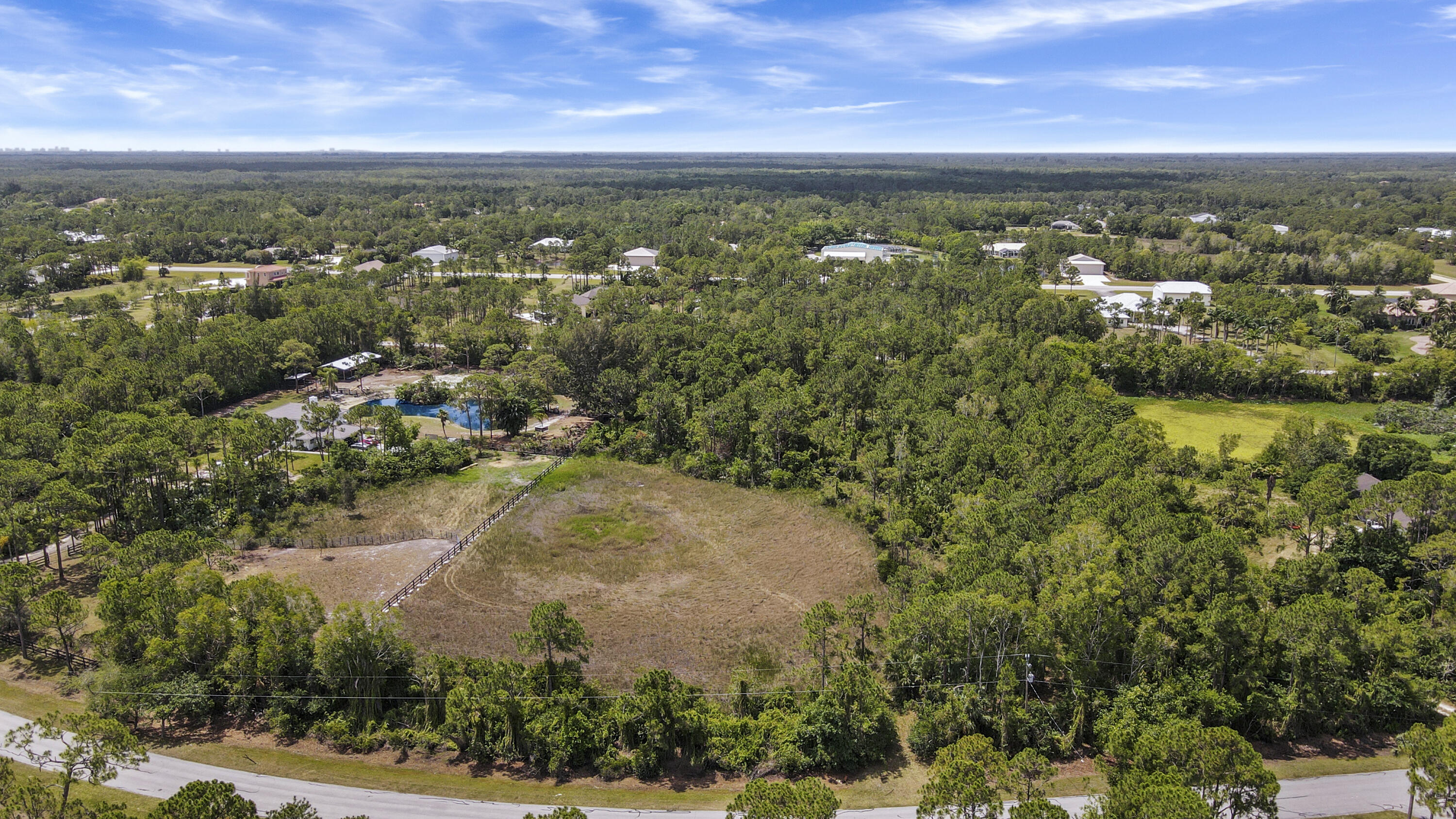 3004 Southeast Ranch Acres Circle Jupiter, FL 33478 - Photo 8 of 15 South view, driveway up the west side