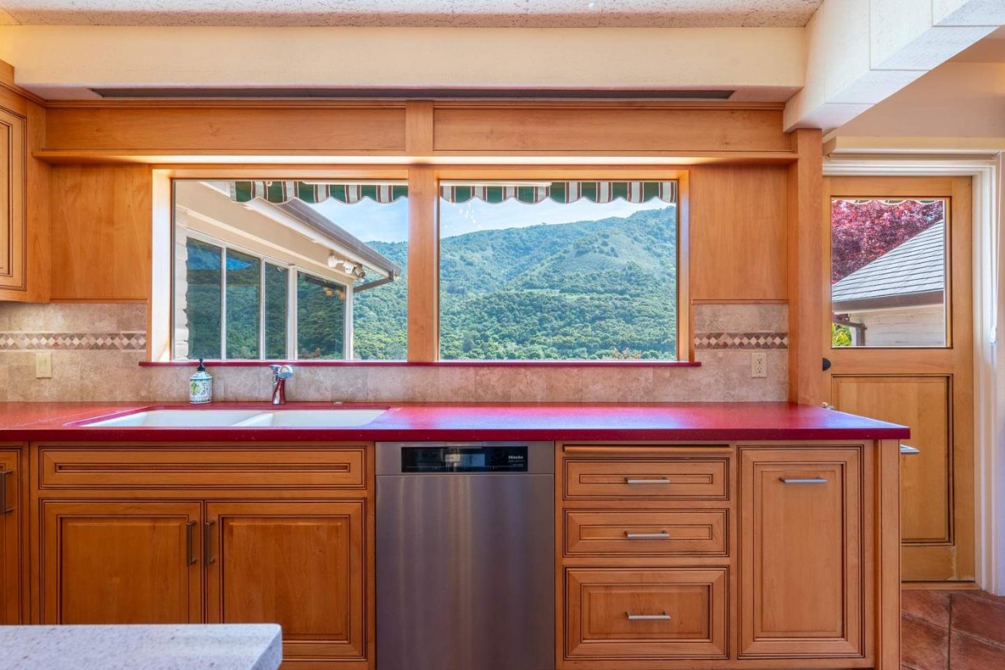 22 Rancho Fiesta Road Carmel Valley, CA 93924 - Photo 11 of 44 a kitchen with a sink and a window