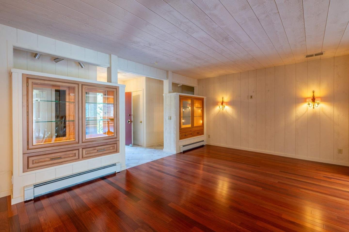 22 Rancho Fiesta Road Carmel Valley, CA 93924 - Photo 14 of 44 a view of an empty room with window and wooden floor