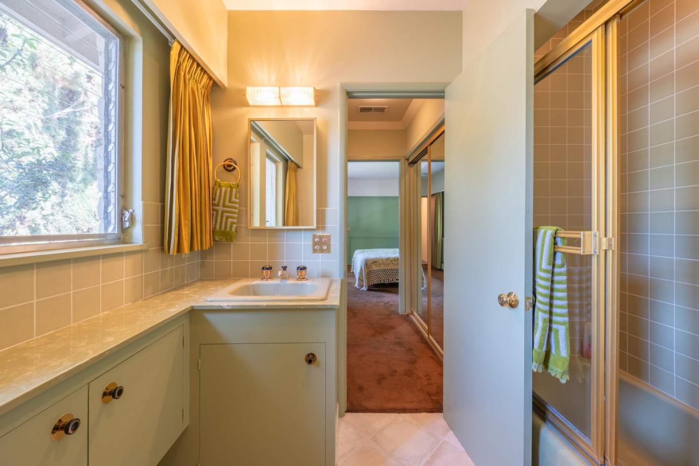 22 Rancho Fiesta Road Carmel Valley, CA 93924 - Photo 15 of 44 a bathroom with a sink and a mirror