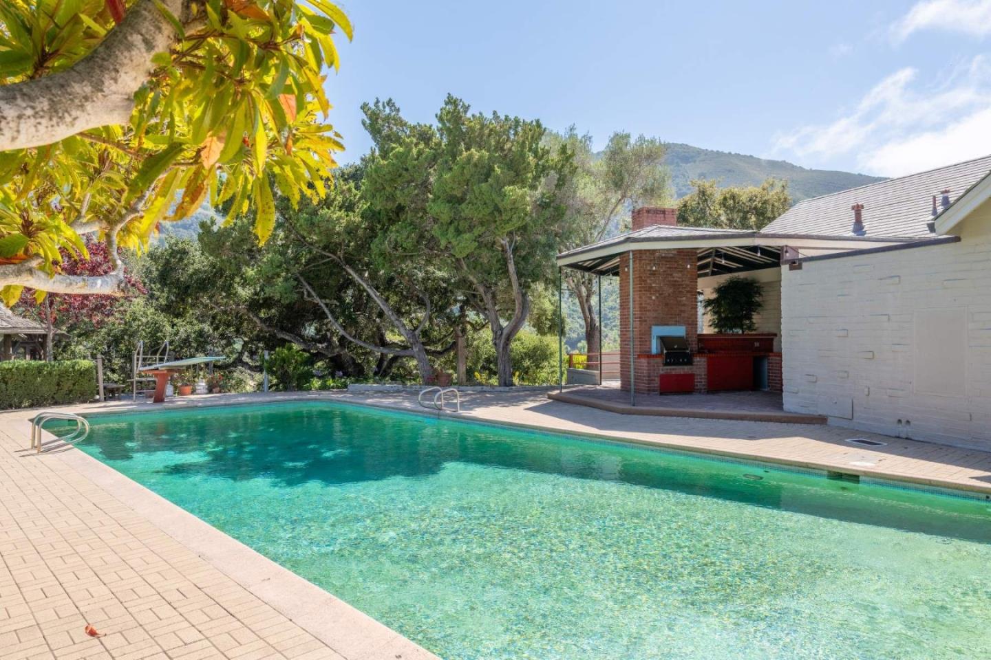 22 Rancho Fiesta Road Carmel Valley, CA 93924 - Photo 20 of 44 a view of a chair and table in the garden