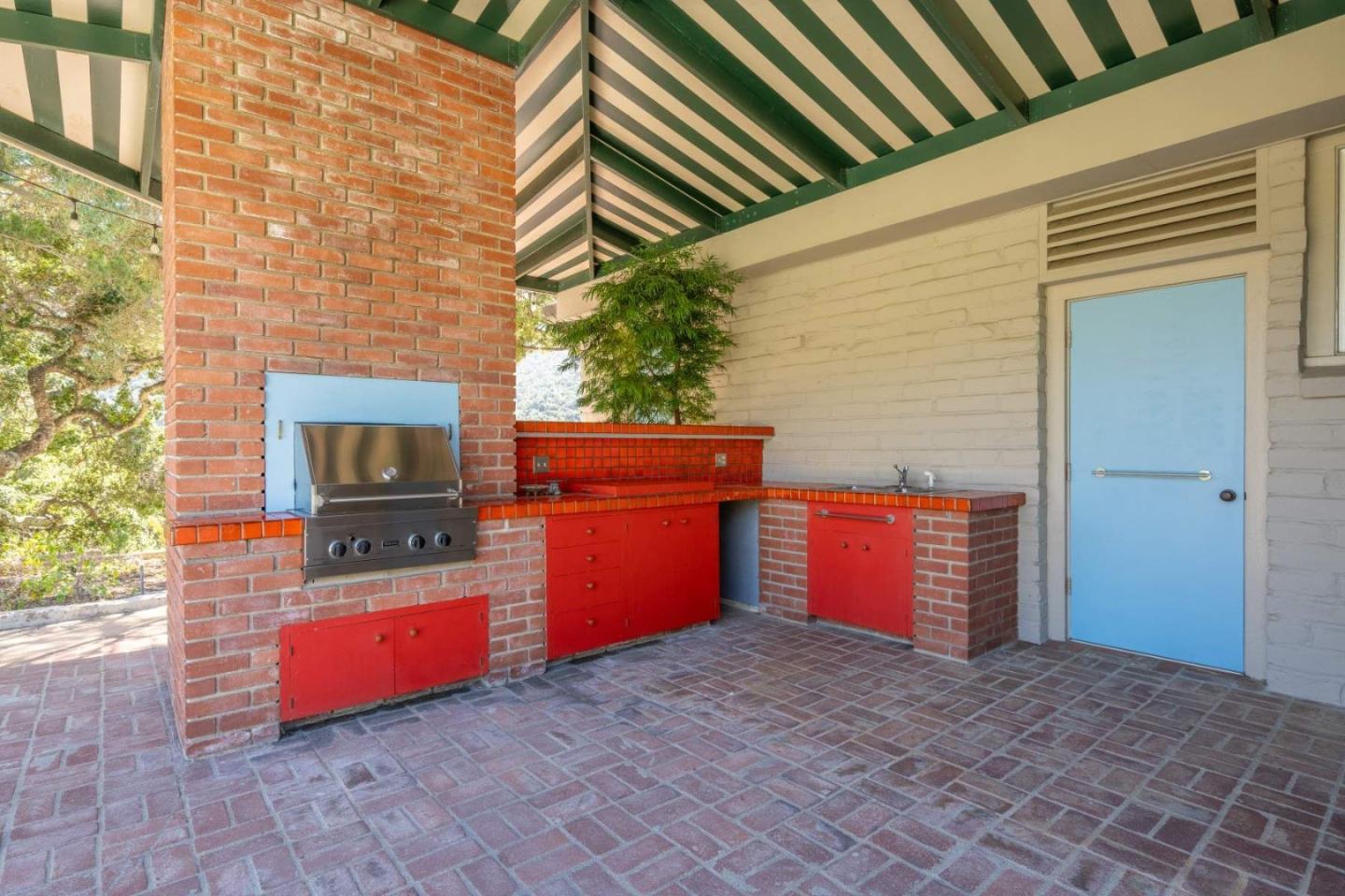 22 Rancho Fiesta Road Carmel Valley, CA 93924 - Photo 22 of 44 a kitchen with granite countertop a stove and a microwave