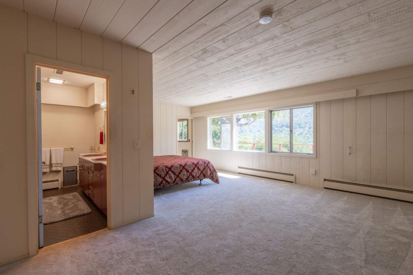 22 Rancho Fiesta Road Carmel Valley, CA 93924 - Photo 31 of 44 a room with bed and a window