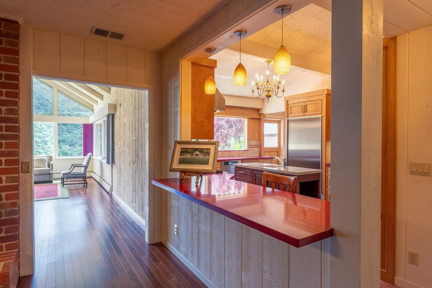 22 Rancho Fiesta Road Carmel Valley, CA 93924 - Photo 9 of 44 a living room with furniture a large window and wooden floor