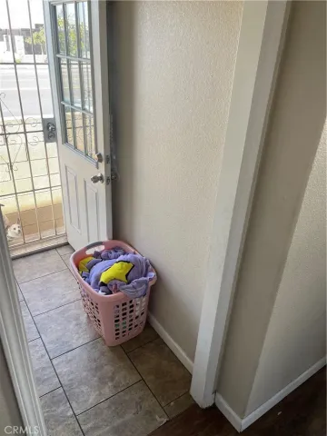 a view of a room with window and furniture