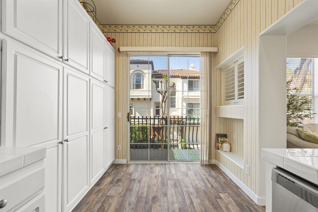 2871 Player Lane Tustin, CA 92782 - Photo 13 of 44 a view of a hallway with wooden floor and a window