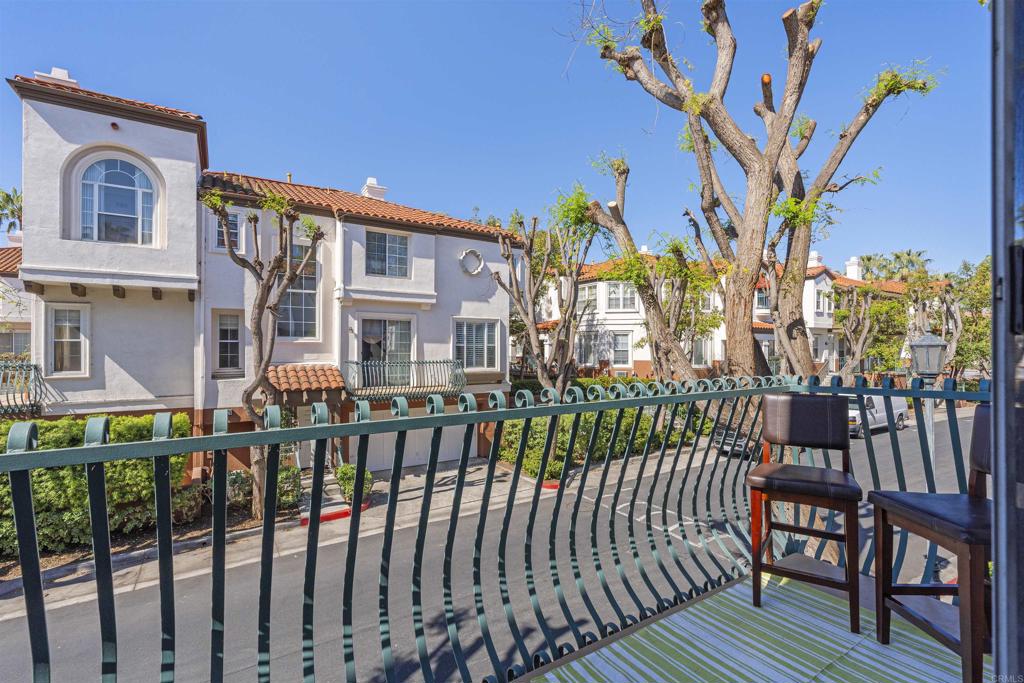 2871 Player Lane Tustin, CA 92782 - Photo 15 of 44 a view of a brick house with large windows and a table and chairs