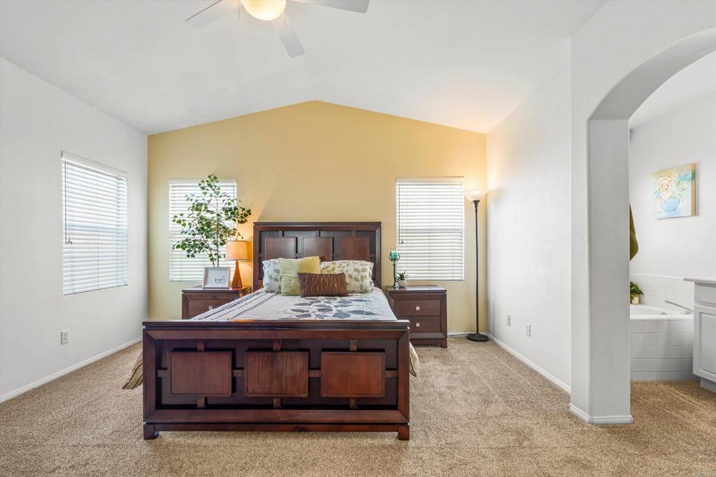 2871 Player Lane Tustin, CA 92782 - Photo 18 of 44 a living room with a bed furniture and a potted plant