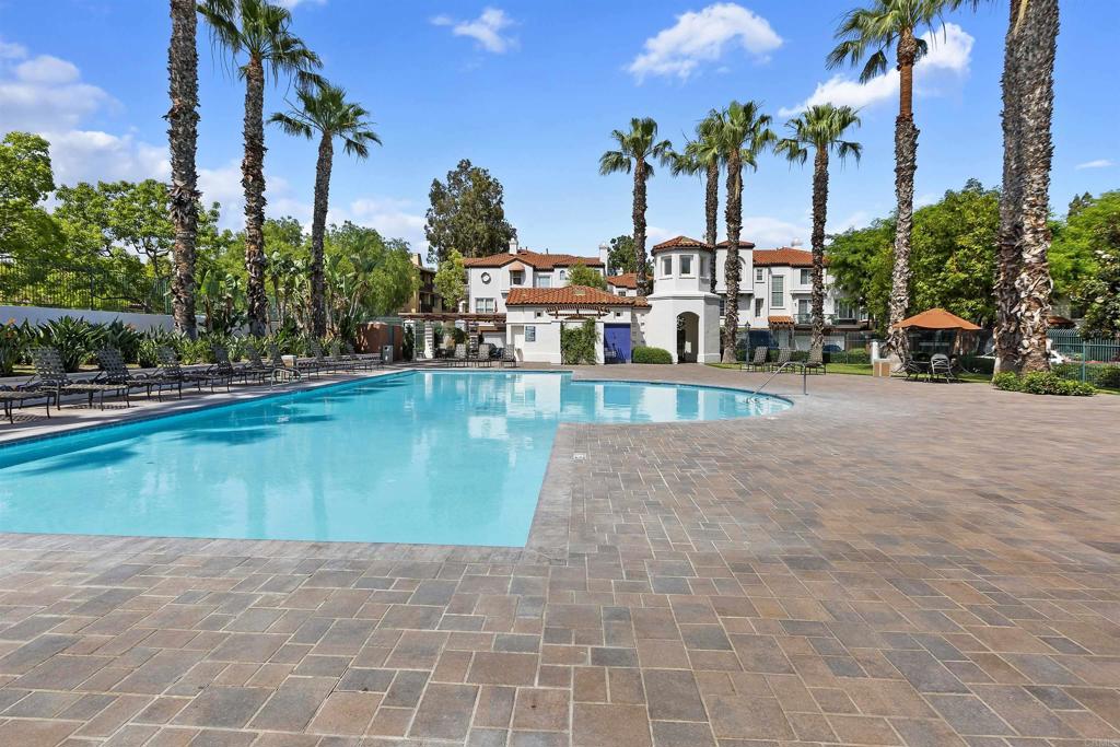 2871 Player Lane Tustin, CA 92782 - Photo 28 of 44 a view of a swimming pool with a bench and lawn chairs