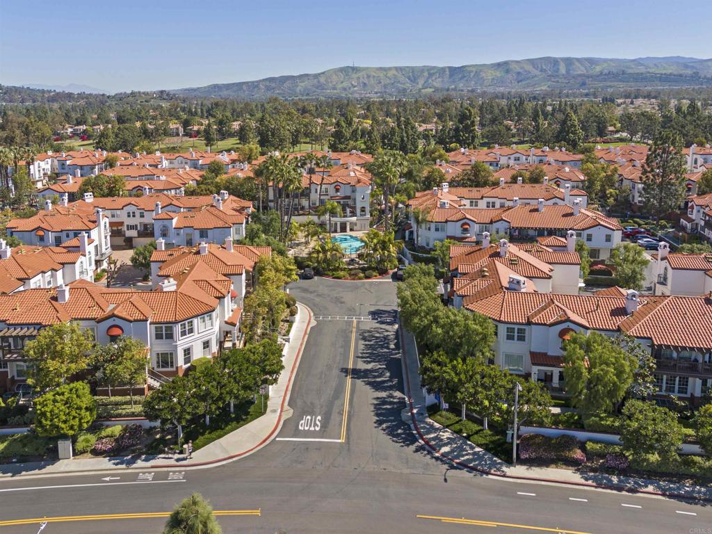 2871 Player Lane Tustin, CA 92782 - Photo 34 of 44 an aerial view of a city with lots of residential buildings and mountain view in back