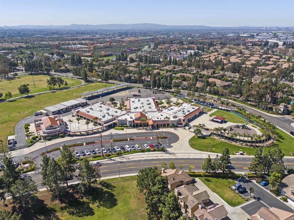 2871 Player Lane Tustin, CA 92782 - Photo 38 of 44 an aerial view of a city with lots of residential buildings ocean and mountain view in back