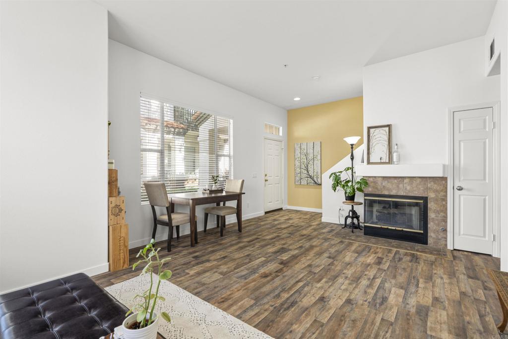 2871 Player Lane Tustin, CA 92782 - Photo 8 of 44 a living room with furniture a fireplace and a table