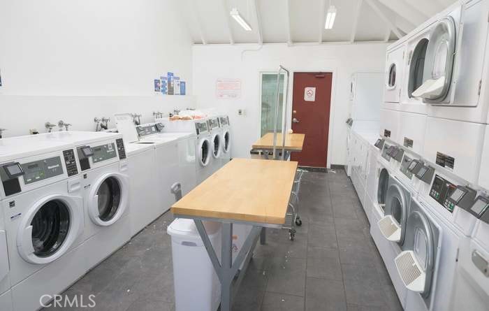 4812 Hollow Corner Road, Unit 151 Culver City, CA 90230 - Photo 9 of 14 a view of a kitchen with fridge and empty racks