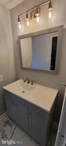 a kitchen with stainless steel appliances a refrigerator stove and sink